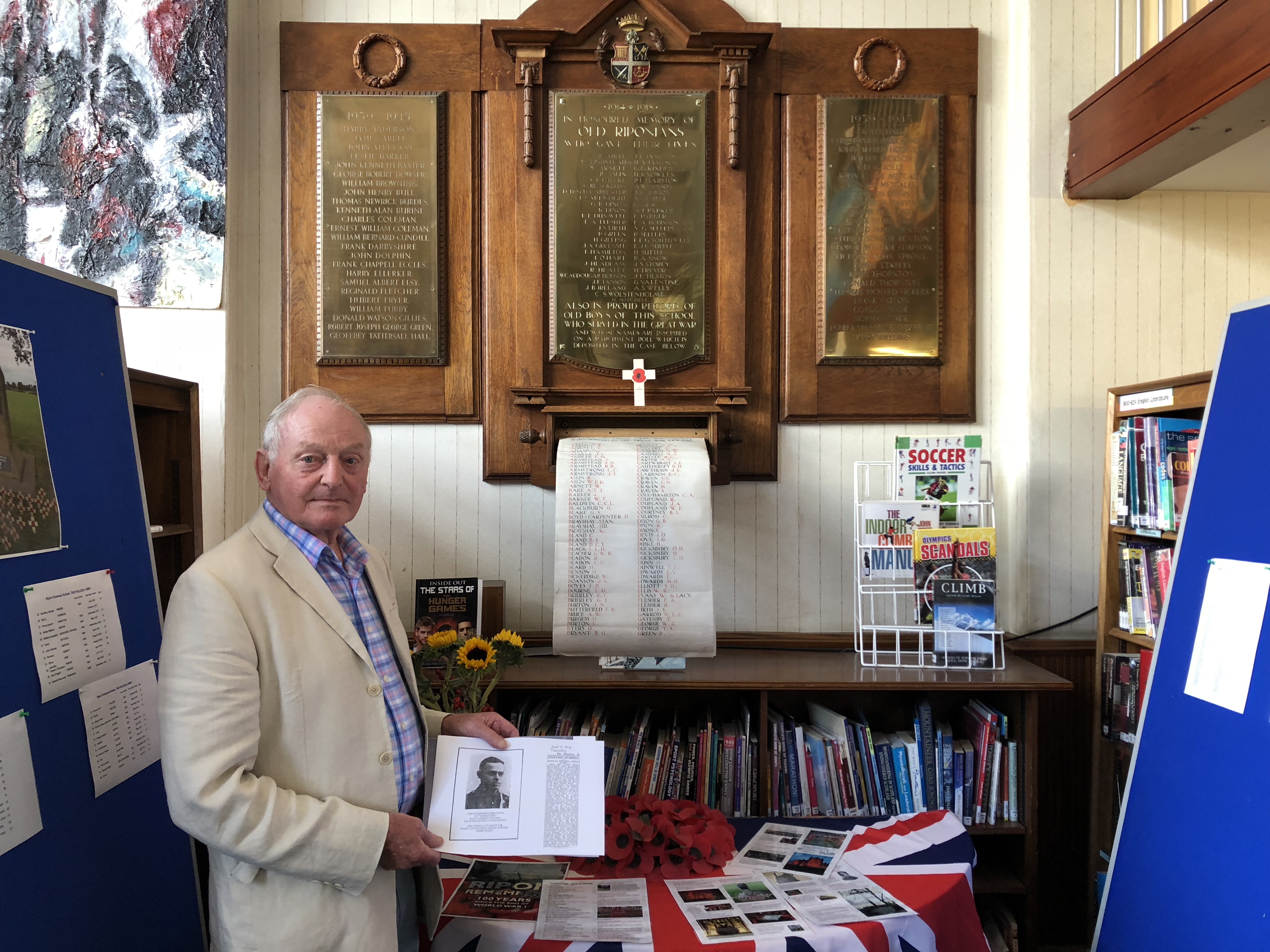 Peter Benson in front of the Roll of Honour