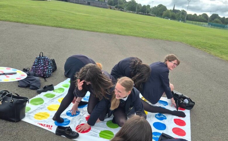 Service students enjoy Twister tangles and tasty treats
