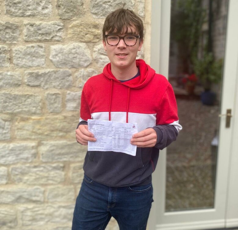 Tom  looks to the future with top GCSE results